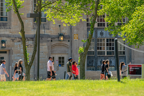 Students and family walking on campus